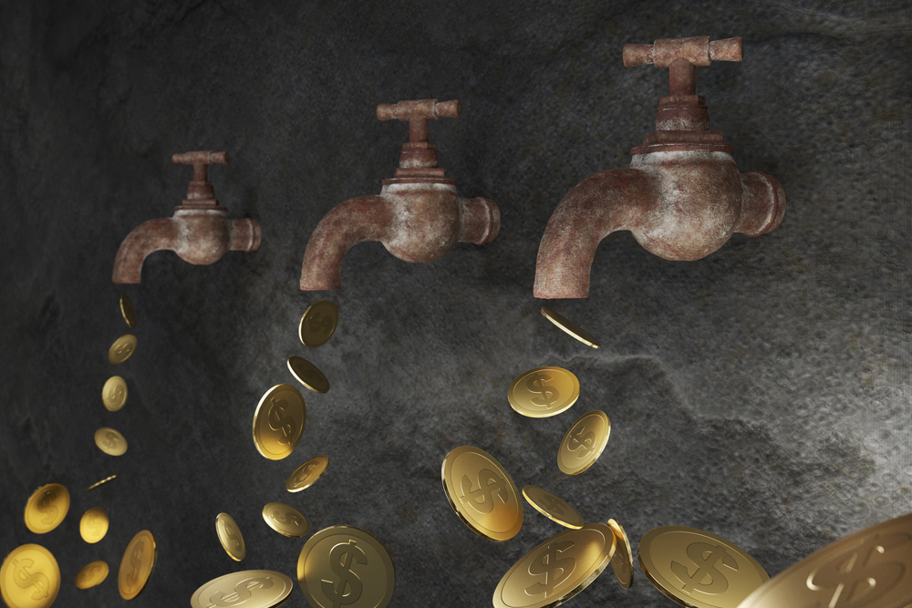 Gold,Coins,Continuously,Flowing,Out,Of,Water,Taps.,Concept,Of